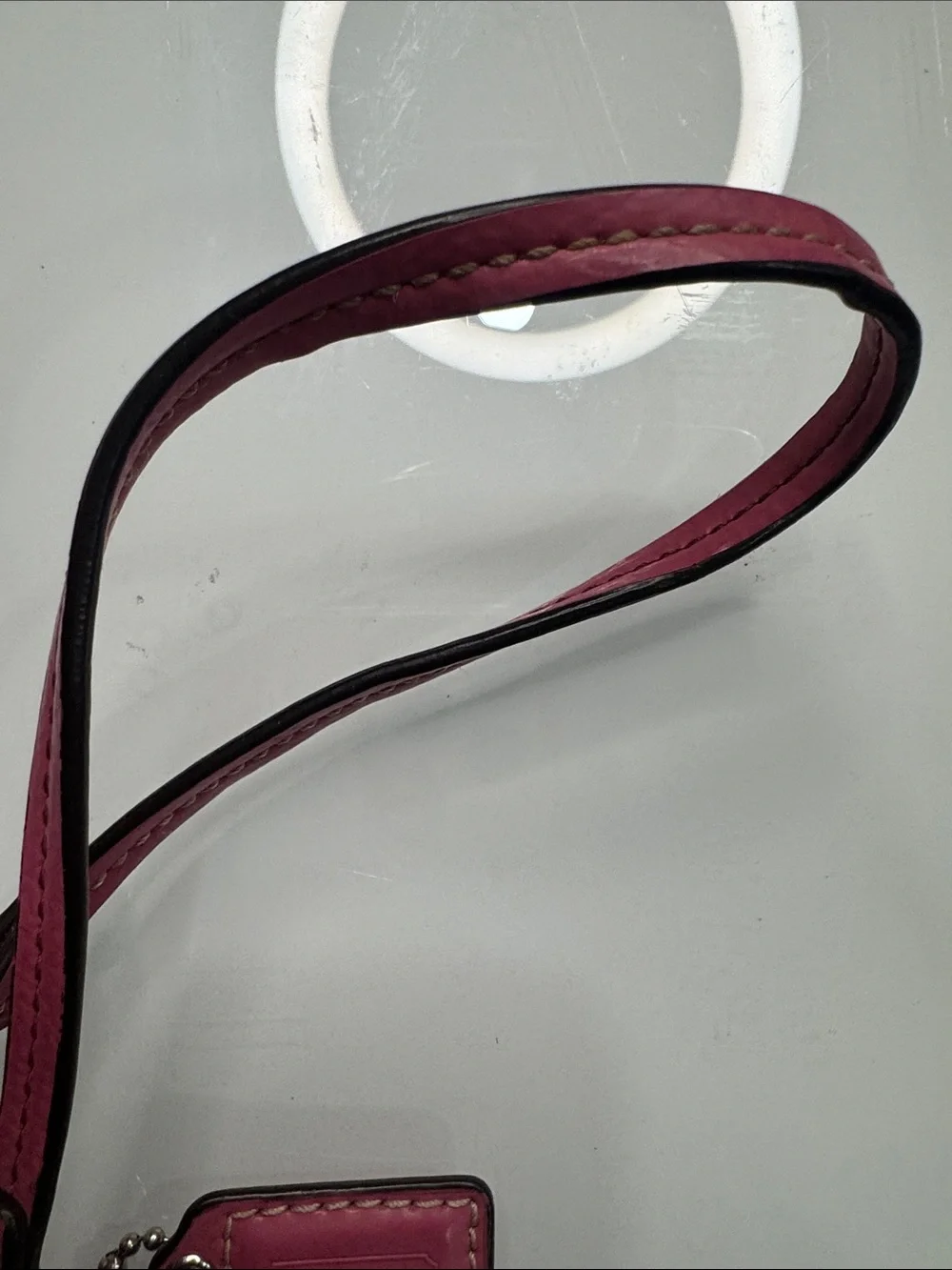 Coach signature wristlet with pink accents and hangtag